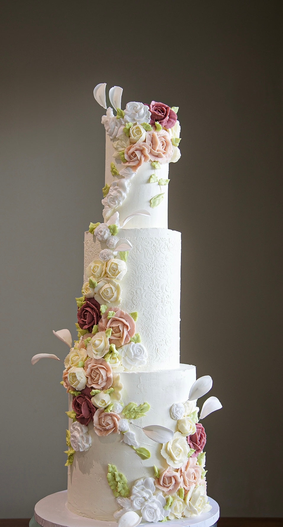 Elegant three-tier wedding cake London